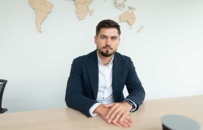 Artis Pukitis, CEO of Hive5, seated at a desk in the Ruptela office.